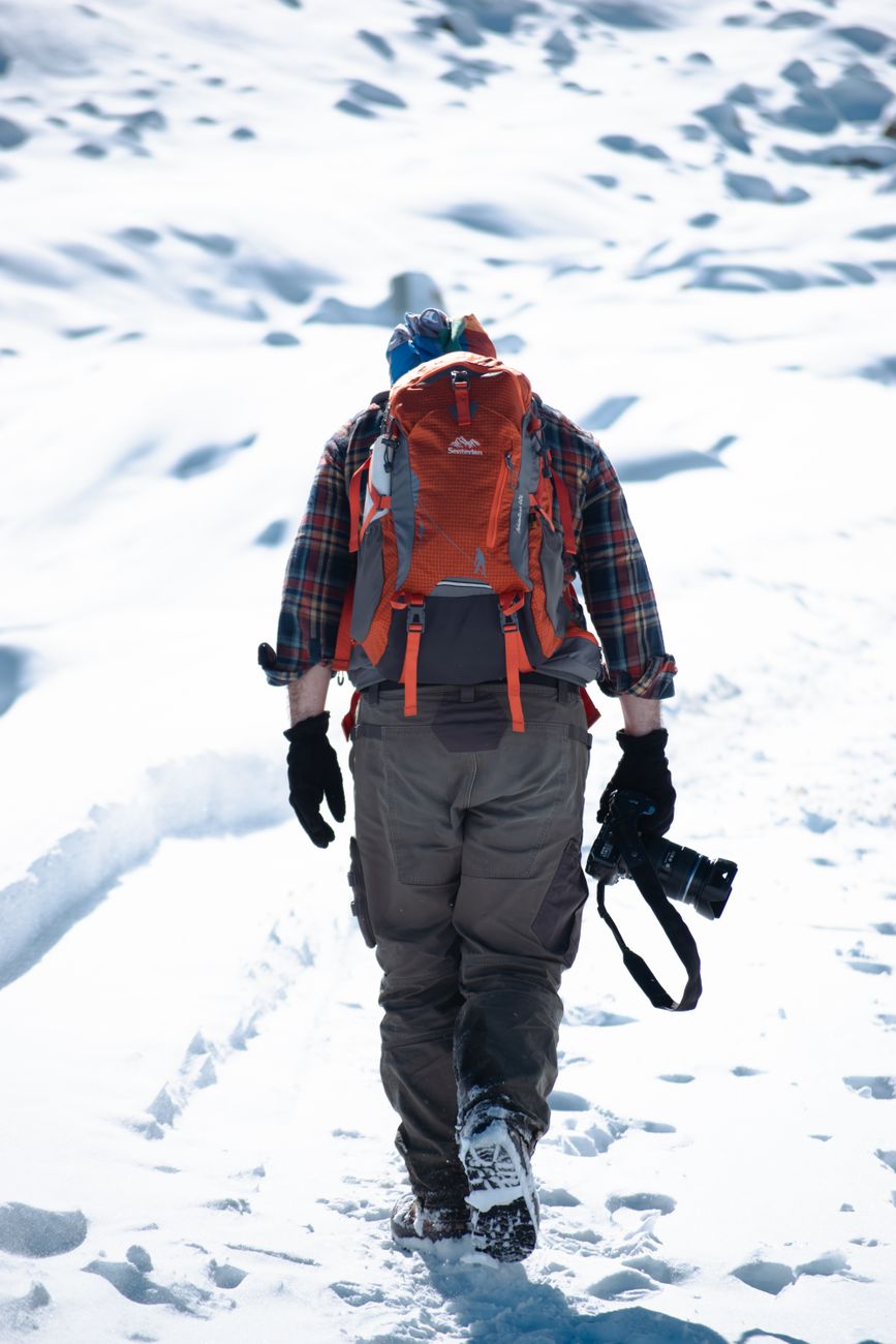 Minimalist trekking gear neatly laid out on canvas cloth